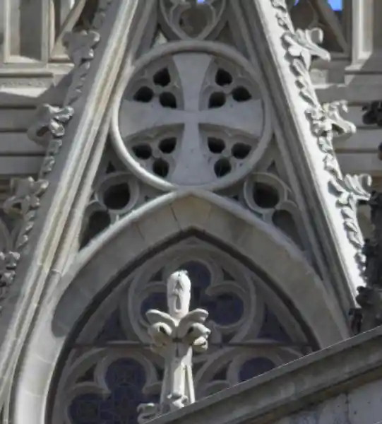 A cross inside a circle and a crescent on top at the Cathedral of Barcelona